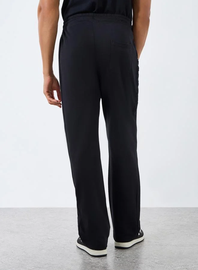 Styli  Men Black Oversized Side Embossed Joggers for Men | Best Price UAE